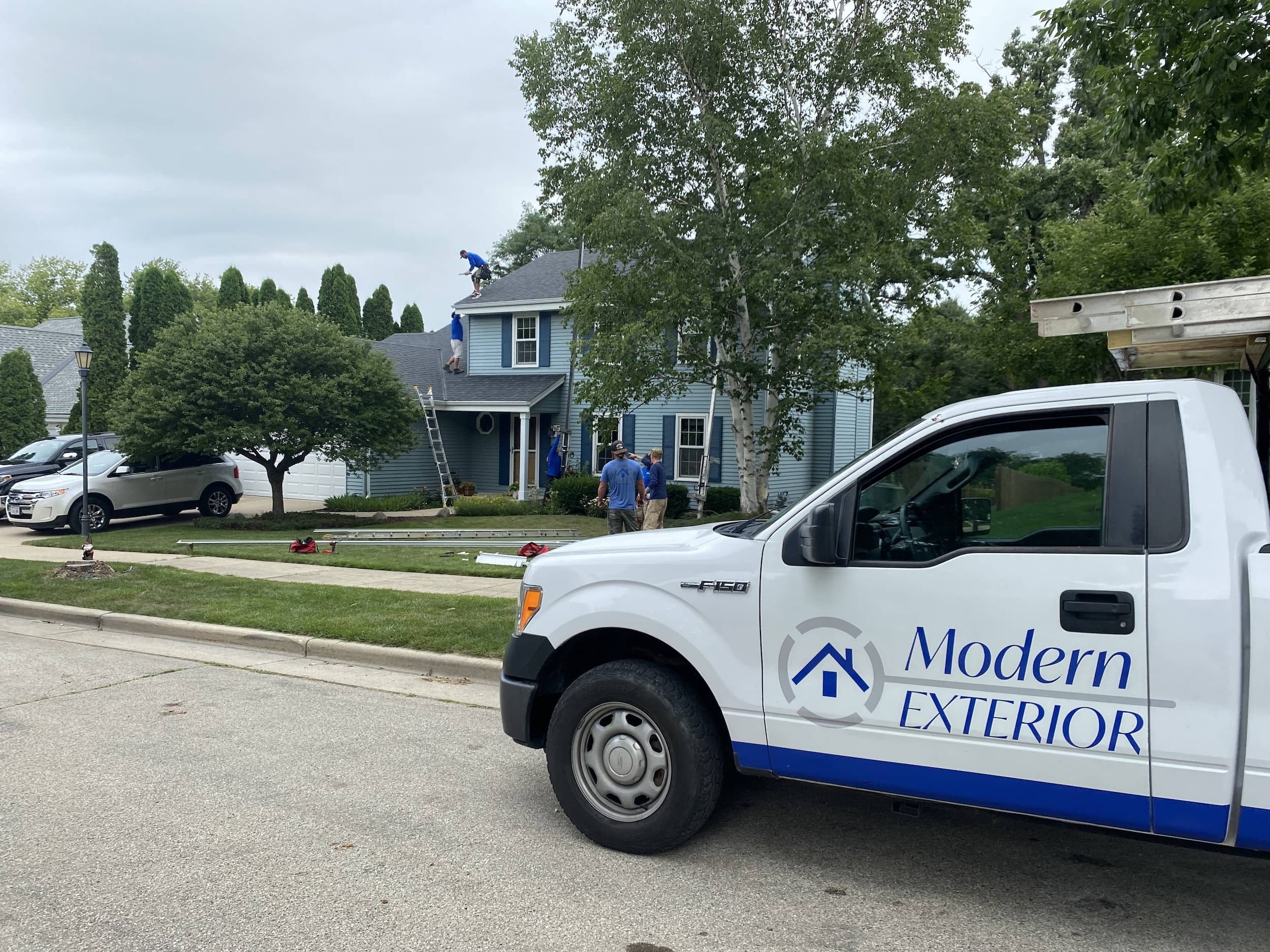 a white truck parked on the side of a road