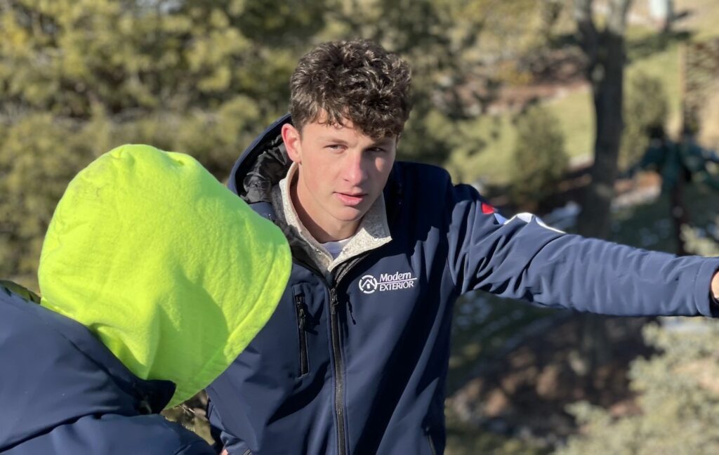 man inspecting the roof giving out reports