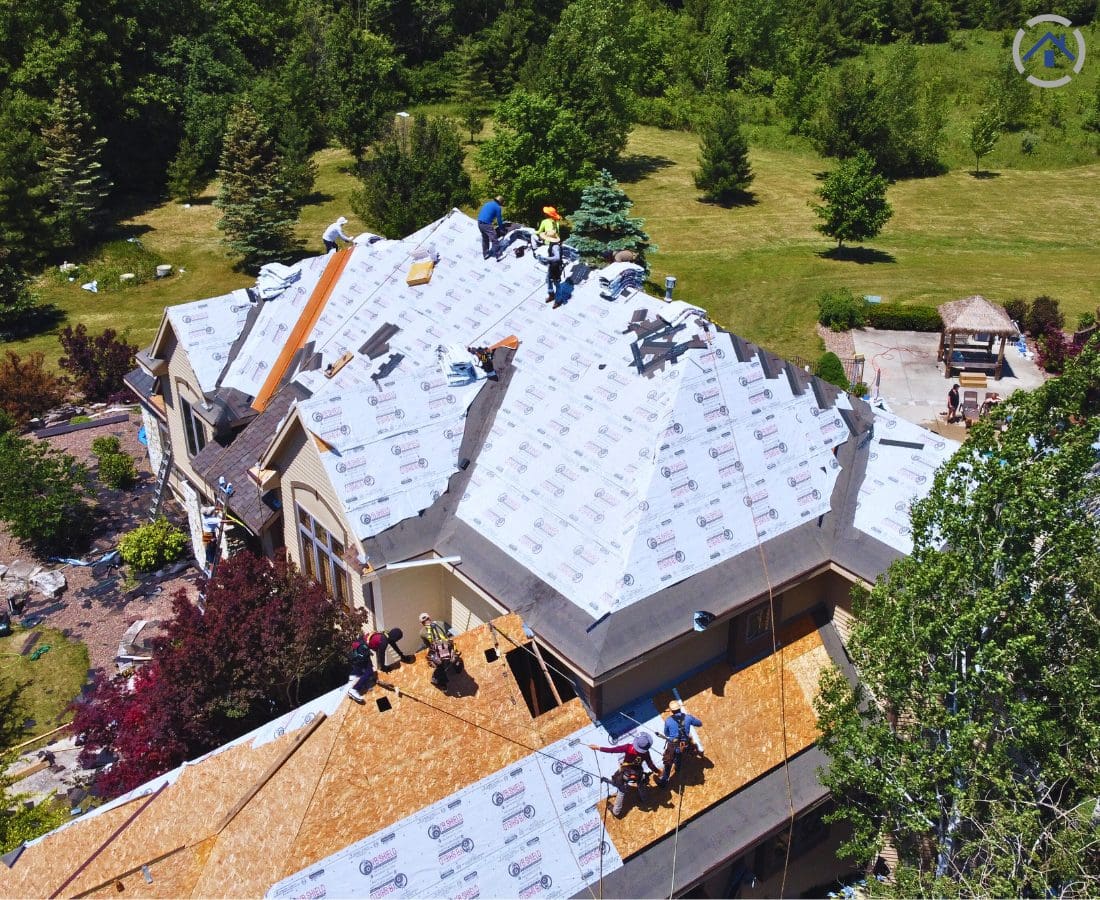 An image of Mexican roofers working as a team to complete a roofing project