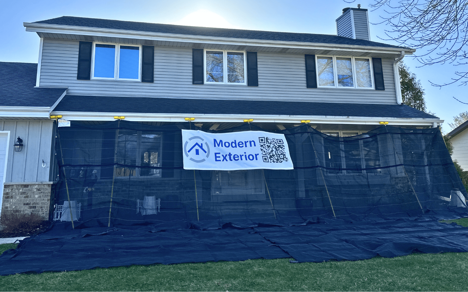 Placing net covers or tarps to protect the belongings below the roof during roof replacement