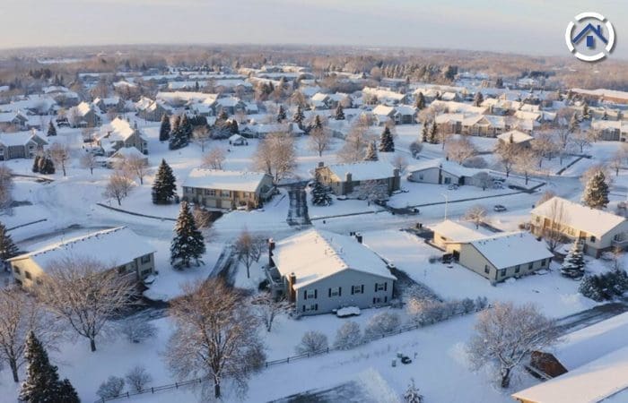 Winter in Wisconsin wherein roofs are all covered with snow.