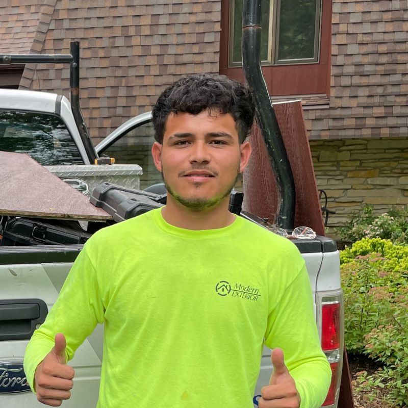 guy with thumbs up in yellow construction shirt