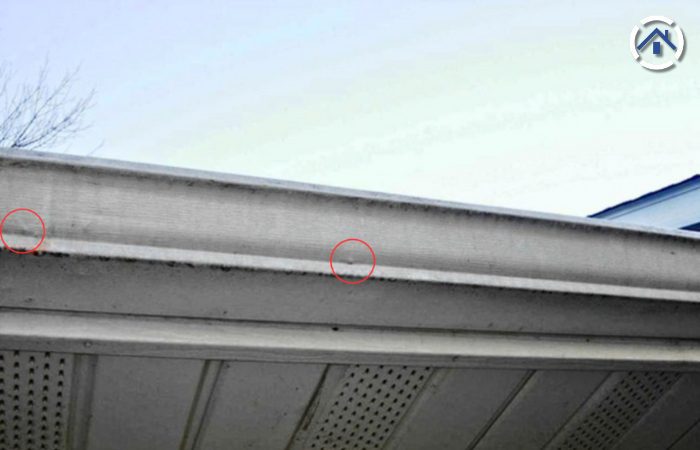 Dents on gutters are visible signs of hail damage