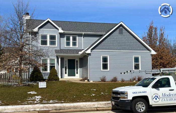 Newly installed gray vinyl siding on home