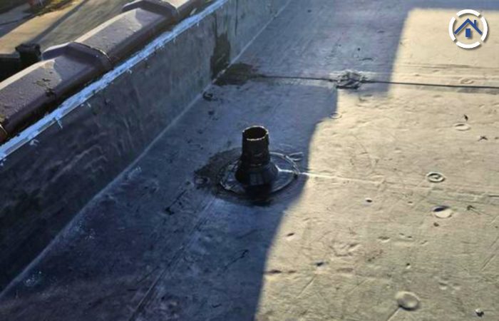 A newly sealed pipe boot seams on EPDM roof