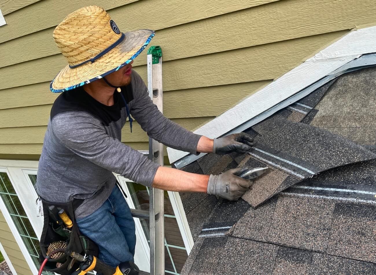 an expert doing a roof repair