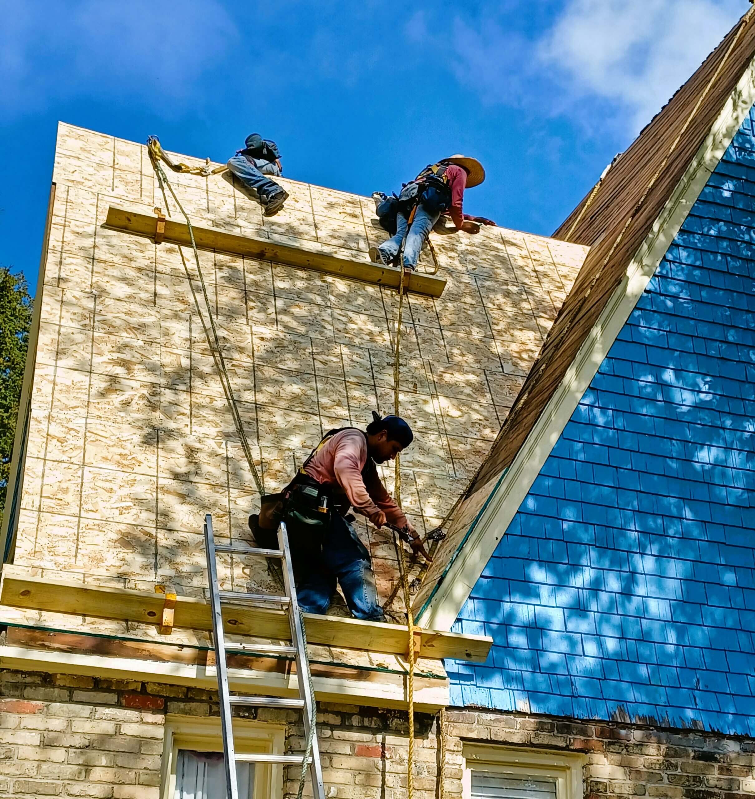 An image of roof contractors doing a repair