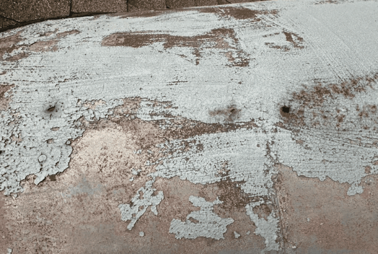 Close-up of deteriorated steel on historical Milwaukee dormer showing rust and damage prior to restoration by Modern Exterior