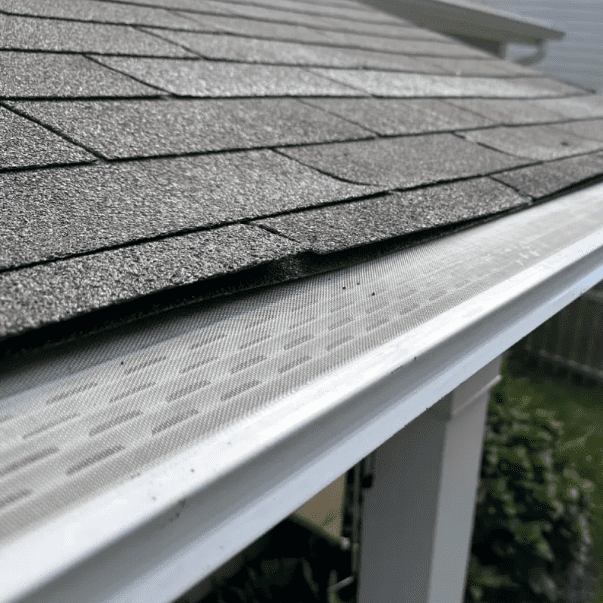 Close-up of a Gekko Gutter Guard preventing clogs while maintaining smooth water flow on a Wisconsin home