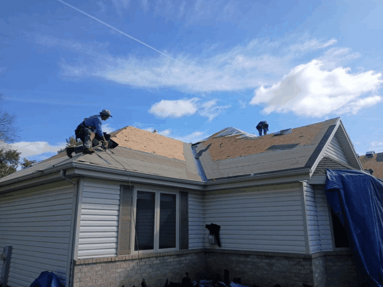 Modern Exterior crew installing ice and water barrier along roof valleys and edges for added leak protection on Hales Corners home