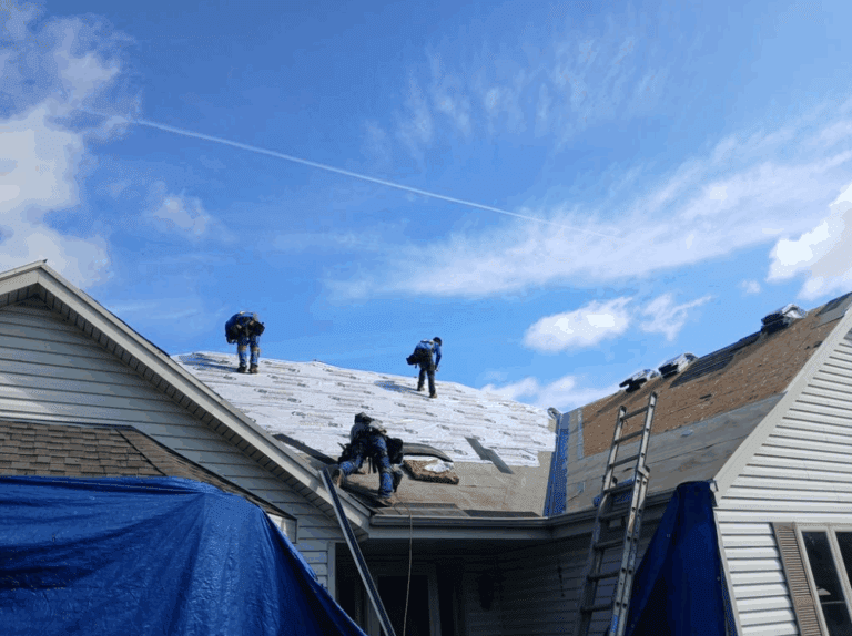 Modern Exterior crew installing durable IKO Cambridge shingles in Weatherwood color, Class 3 hail-resistant for superior impact protection, during hail damage roof replacement on Hales Corners home