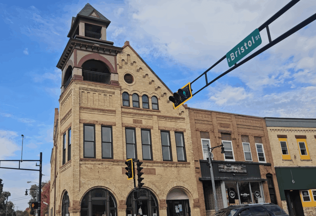 Sun Prairie Old City Hall building, WI, part of the area where Modern Exterior provides expert roof replacement, siding, and gutter services for local homeowners.