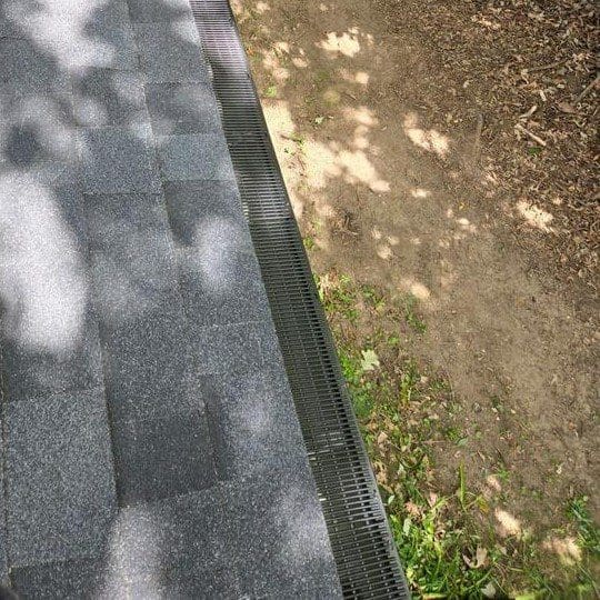 Close-up of Raindrop Gutter Guards installed on Twin Lakes home as part of new seamless gutter system by Modern Exterior
