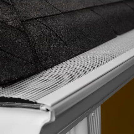Close-up view of an Armour Guard gutter screen showing its fine aluminum mesh design that helps block small debris like dirt and roof grit.