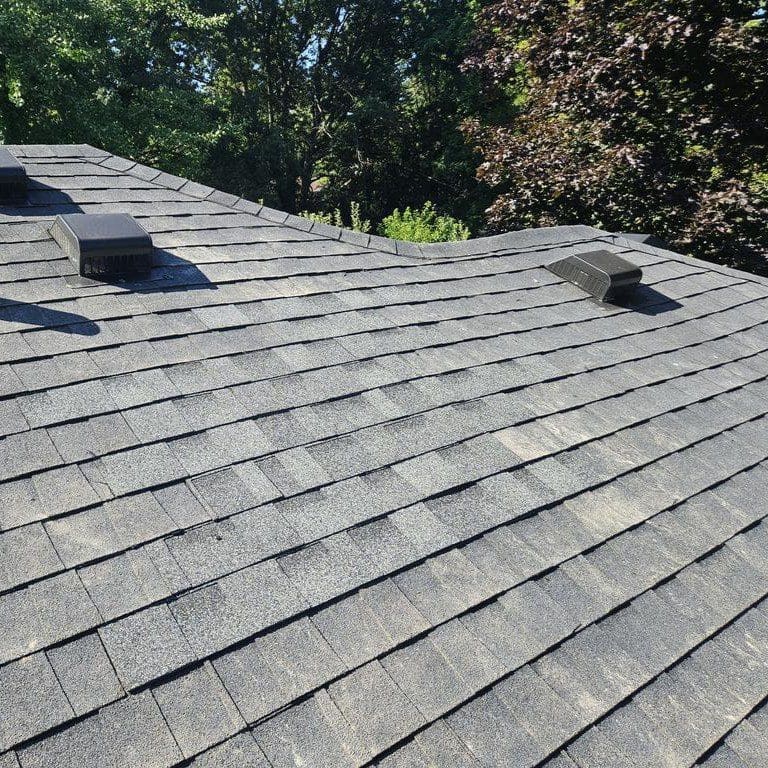 Completed roof with seamless shingle replacement after full chimney tear-down on a Brookfield home by Modern Exterior
