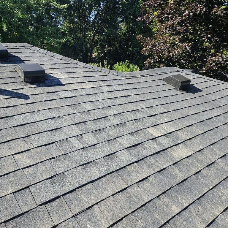 Completed roof with seamless shingle replacement after full chimney tear-down on a Brookfield home by Modern Exterior