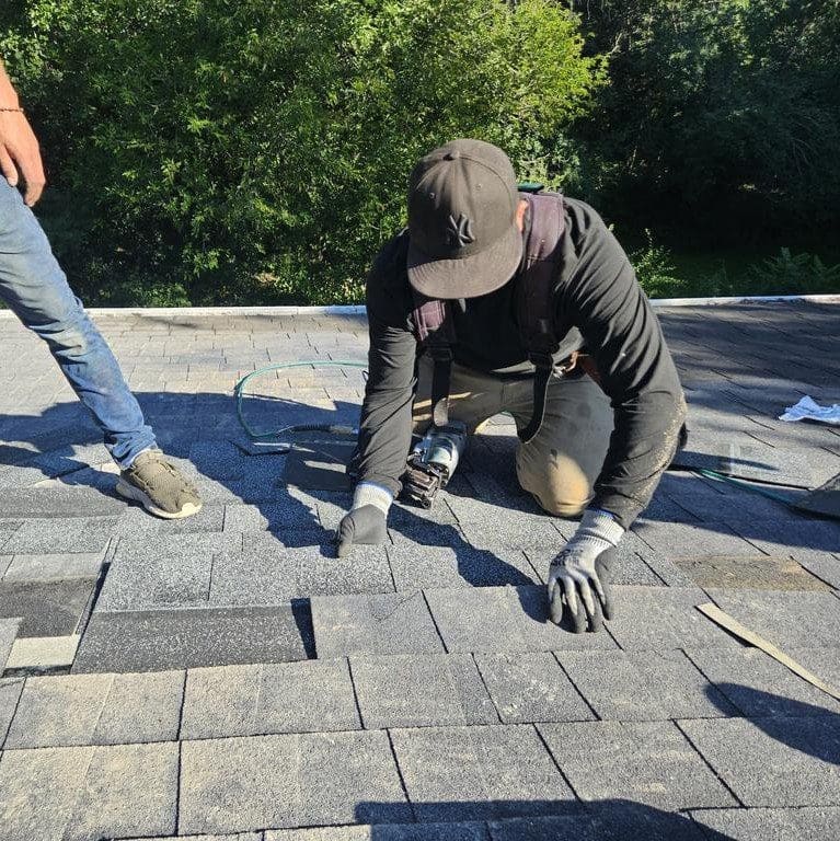 Seamlessly matched shingles installed over roof patch after chimney tear-down on a Brookfield home by Modern Exterior