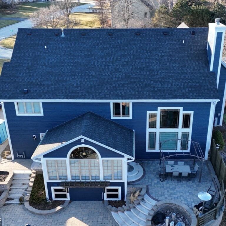 After rear view of Brookfield home showcasing newly installed Nordic Granite Black roof with upgraded skylights and completed roofing system