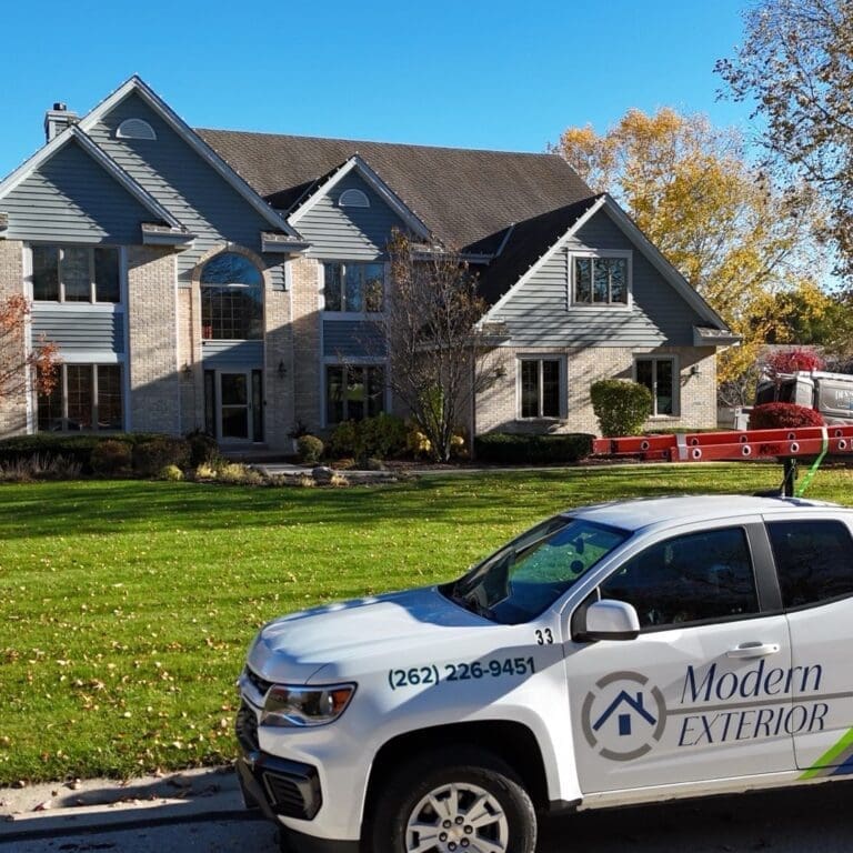 Before photo of Brookfield home with aging roof and Modern Exterior work truck parked in driveway prior to roof replacement