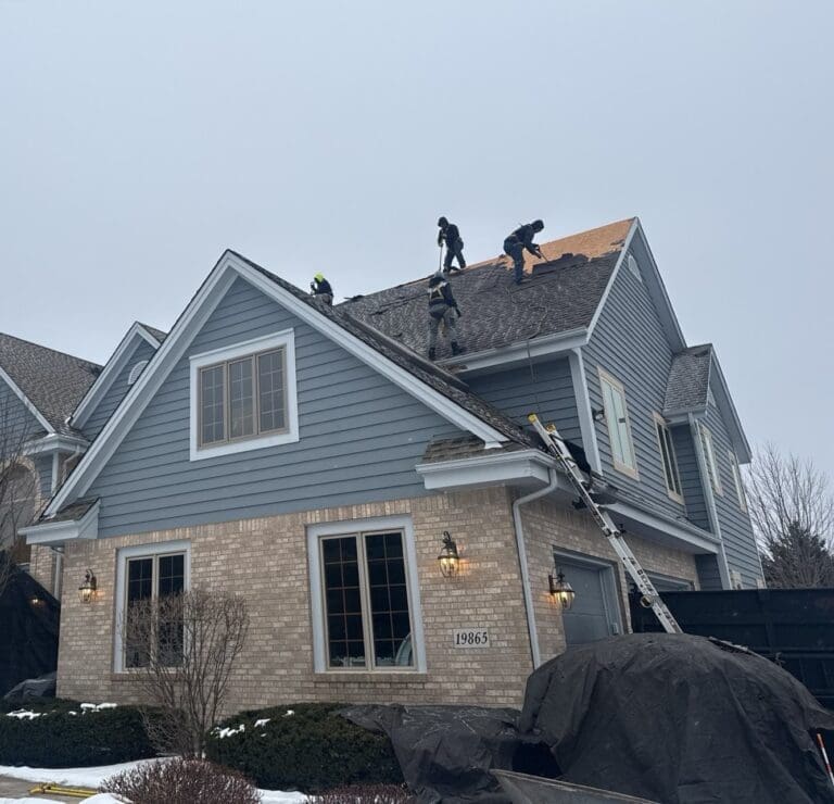 During roof tear-off process in Brookfield, showing old shingles removed down to the decking prior to installing the new Nordic roofing system