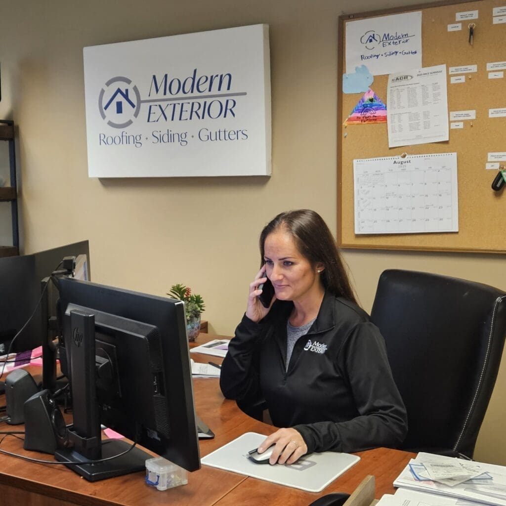 Modern Exterior team member scheduling a roof inspection appointment.