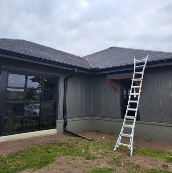 Modern Exterior roofing contractor ladder set up to inspect a residential asphalt shingle roof in Eagle, Wisconsin.