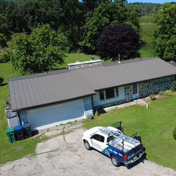 Standing seam metal roof installed on a residential home in Big Bend, Wisconsin.