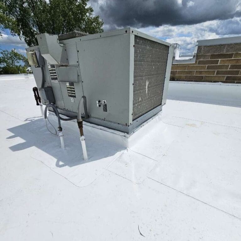 PVC commercial roofing at Central Bark Sussex showing heat-welded flashing detail around rooftop unit for watertight seal