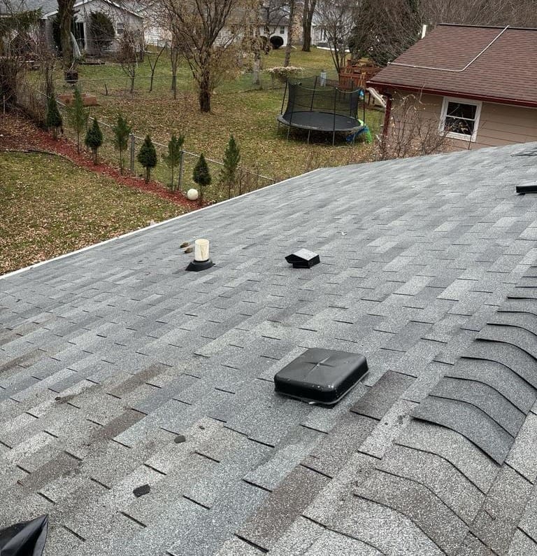 Roof vent repair with new flashing and sealant applied to prevent water intrusion.